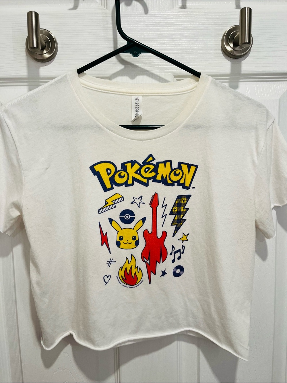 Next Level Apparel White Pokémon Logo Crop Tee with Yellow & Blue Print